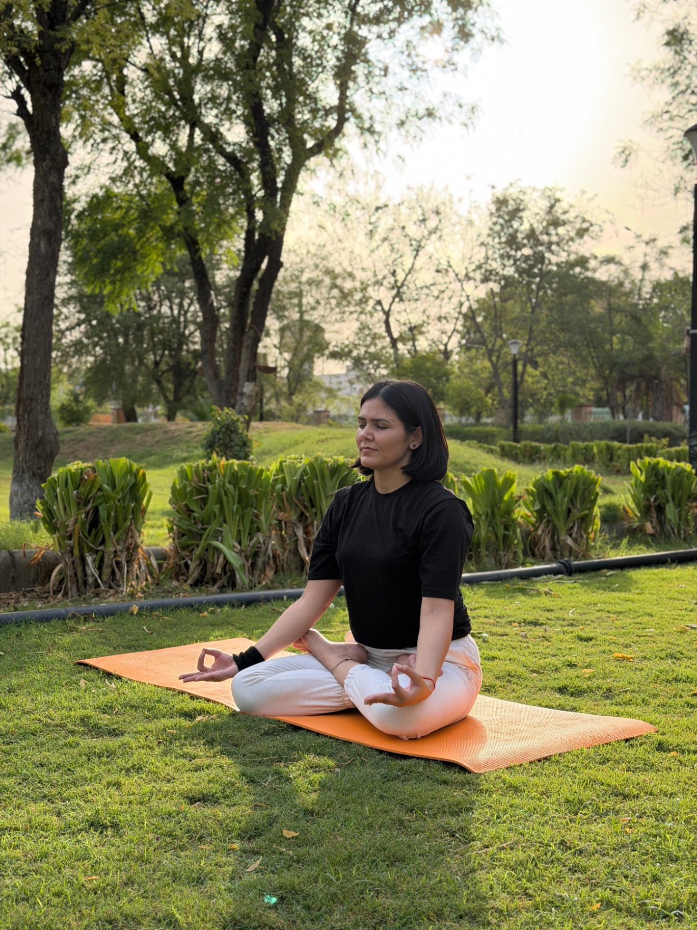 Priya in seated lotus meditation