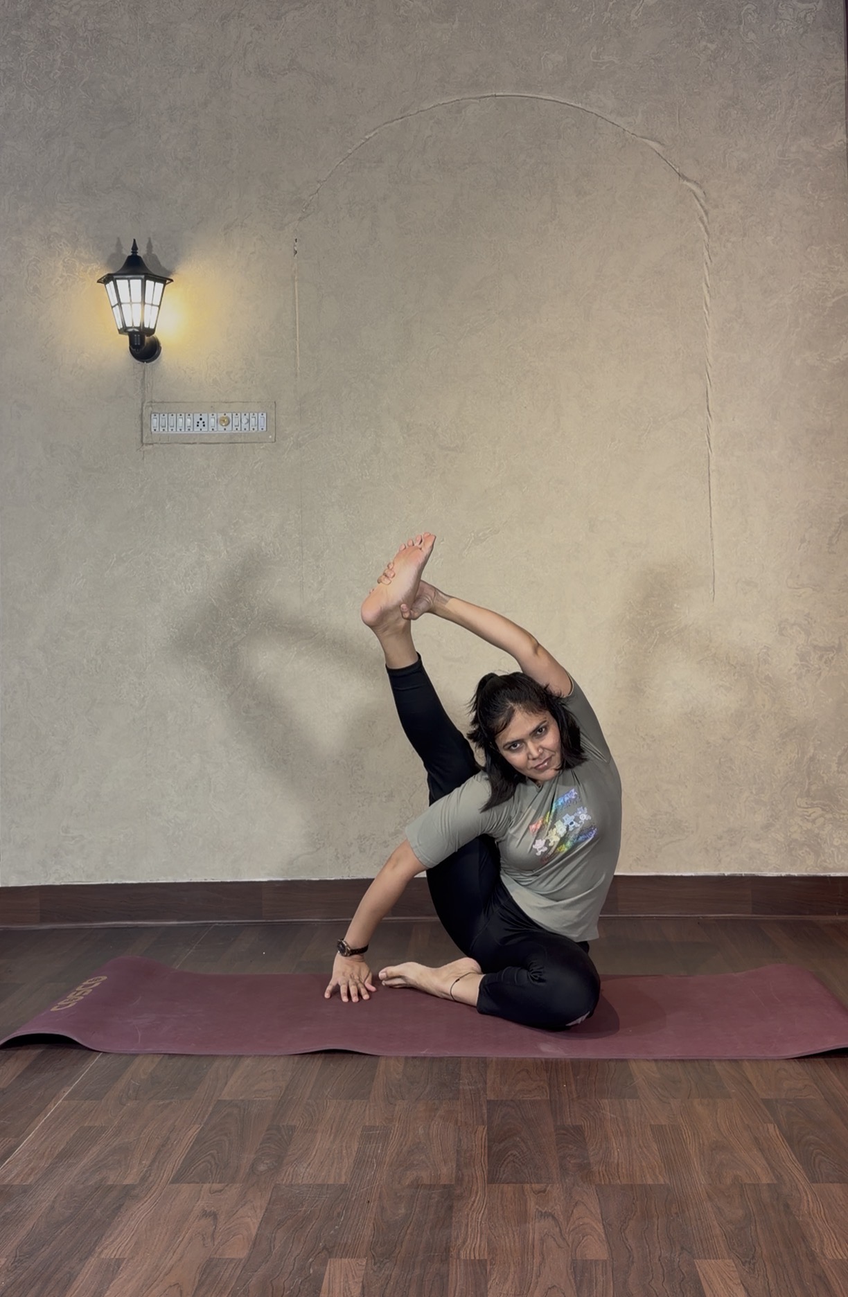 Priya demonstrating Compass Pose
